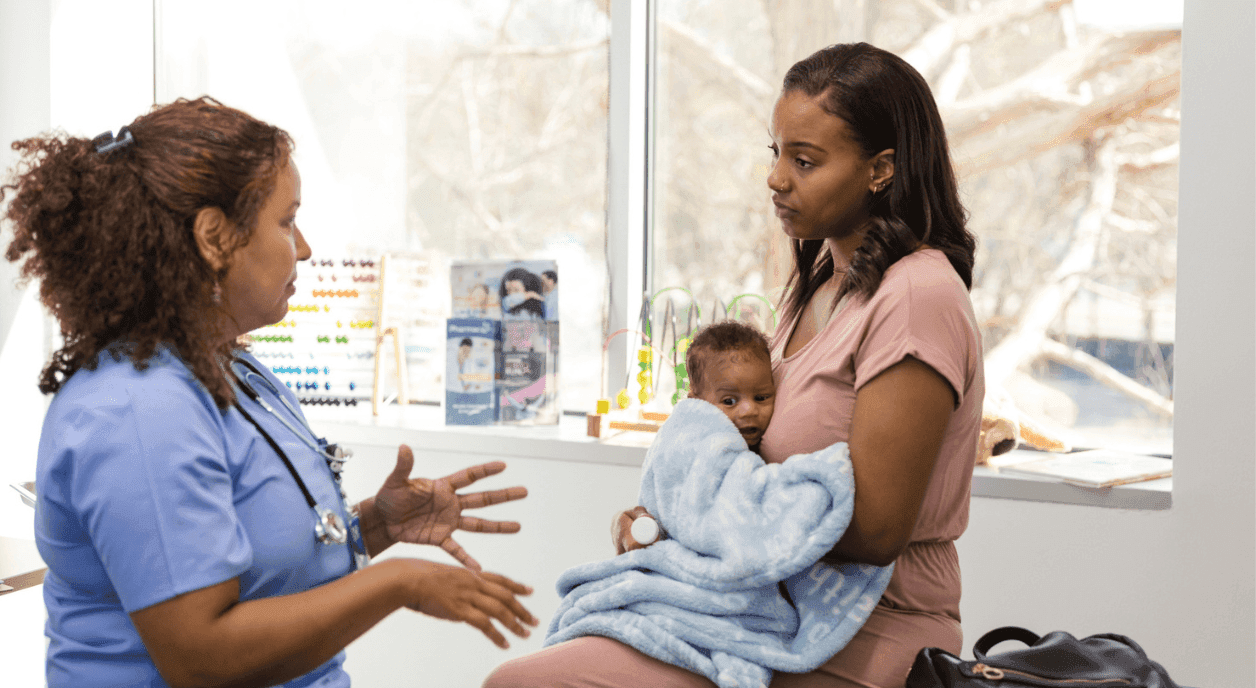 A mother and her baby at a rural health nonprofit.